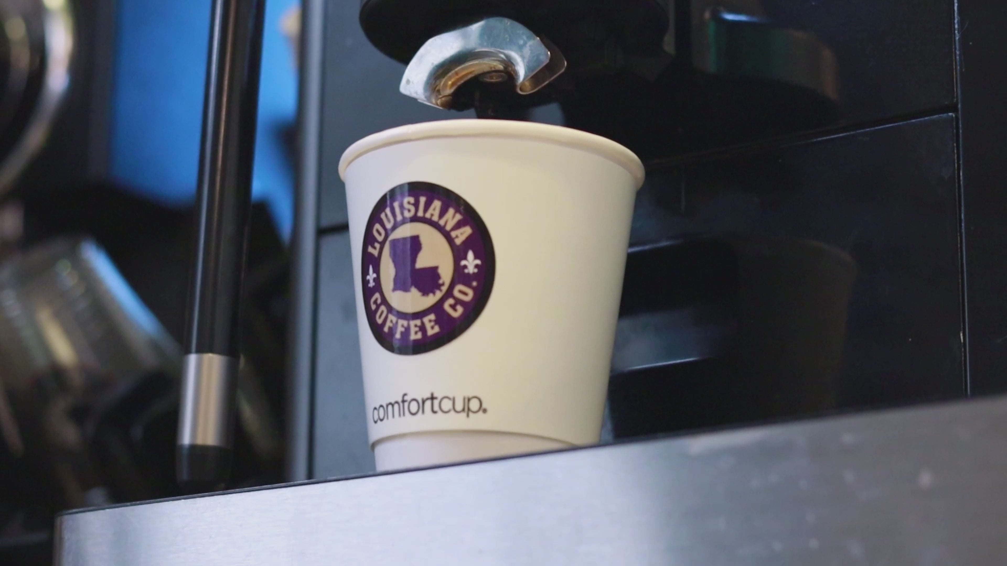 Load video: A video showing louisiana coffee company's coffee, louisiana, and coffee beans.
